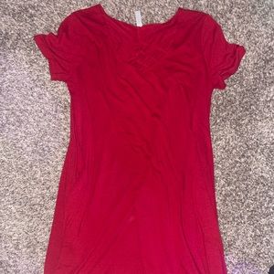 Red dress with pockets. Crisscross detailing on the front